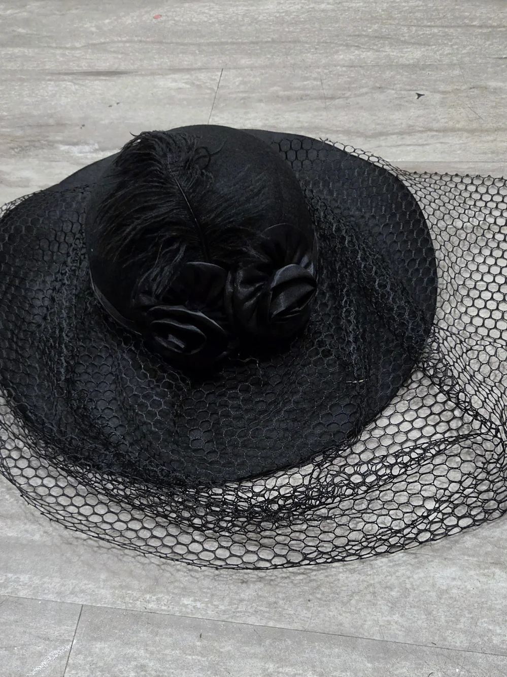 Elegant Black Veiled Hat with Rosette Accents